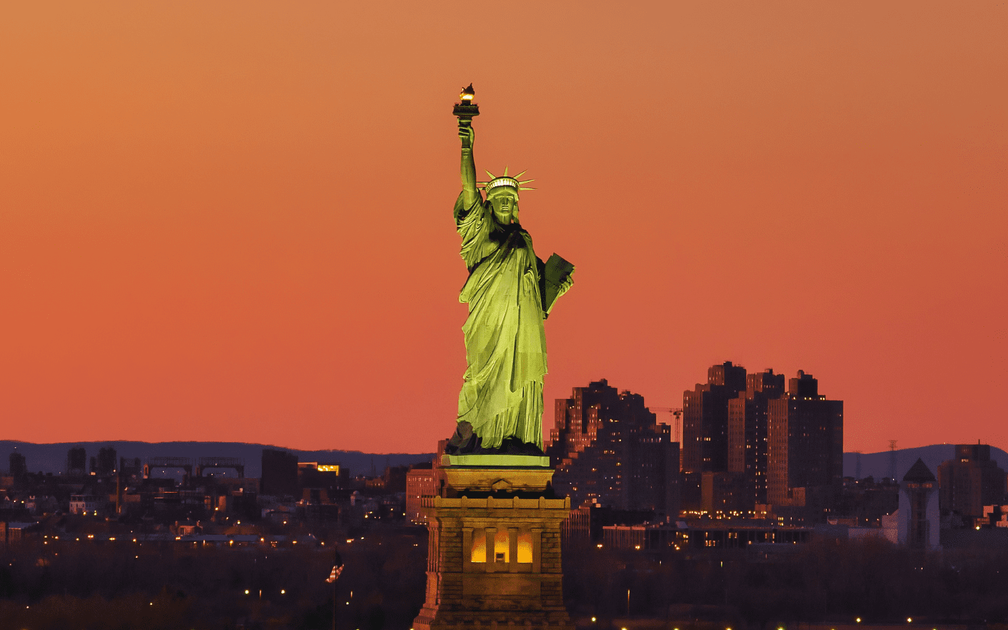 A photo of the Statue of Liberty at dusk.
