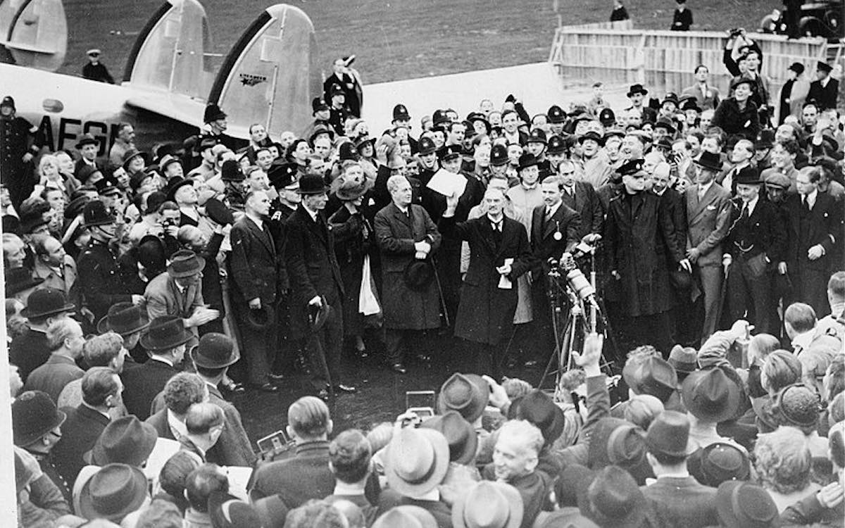 A black and white photo of Neville Chamberlain