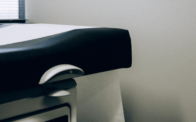 A medical exam table in a doctor’s office.