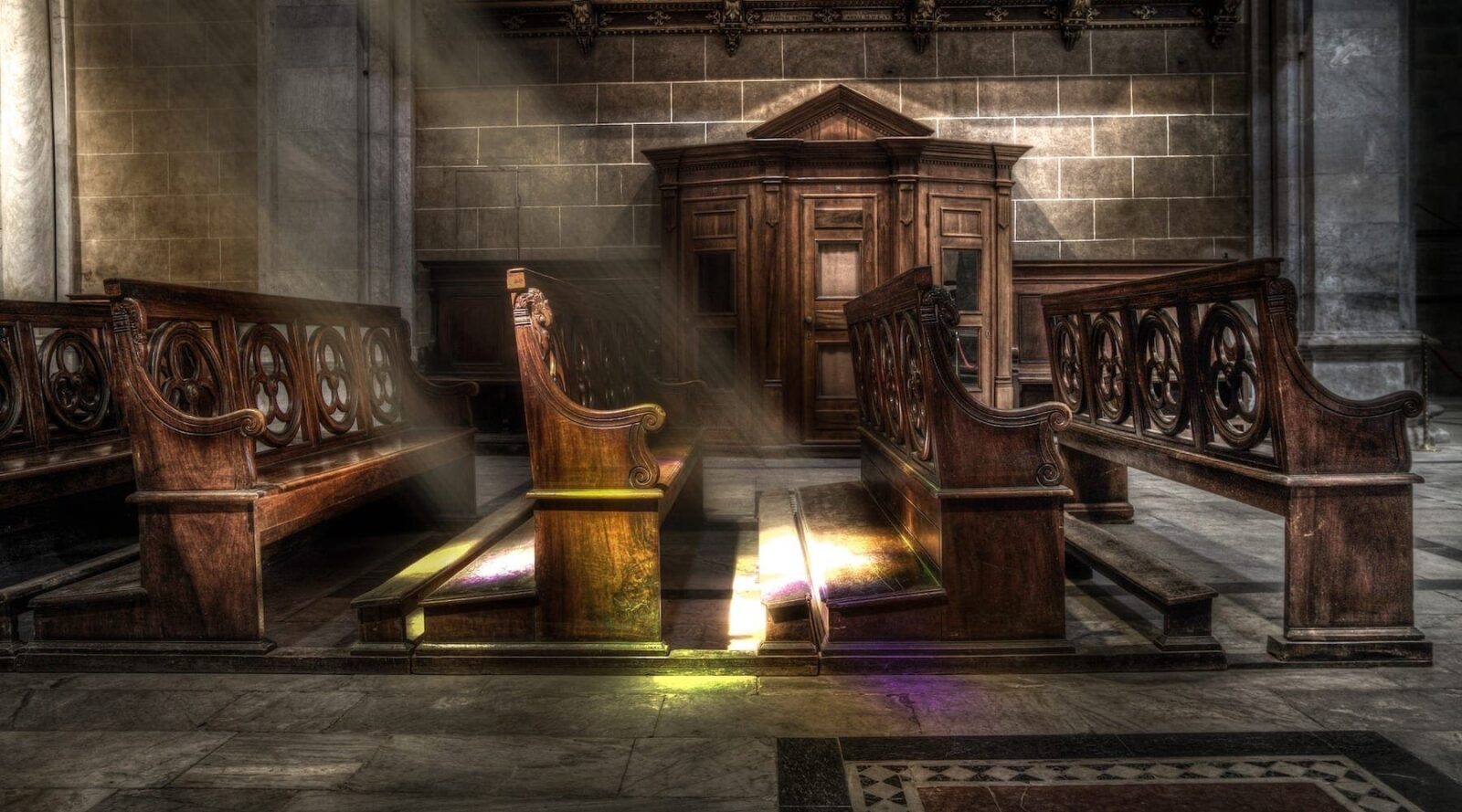 Church pews with sunlight shining down|Stressed man chest deep in rising rough waters