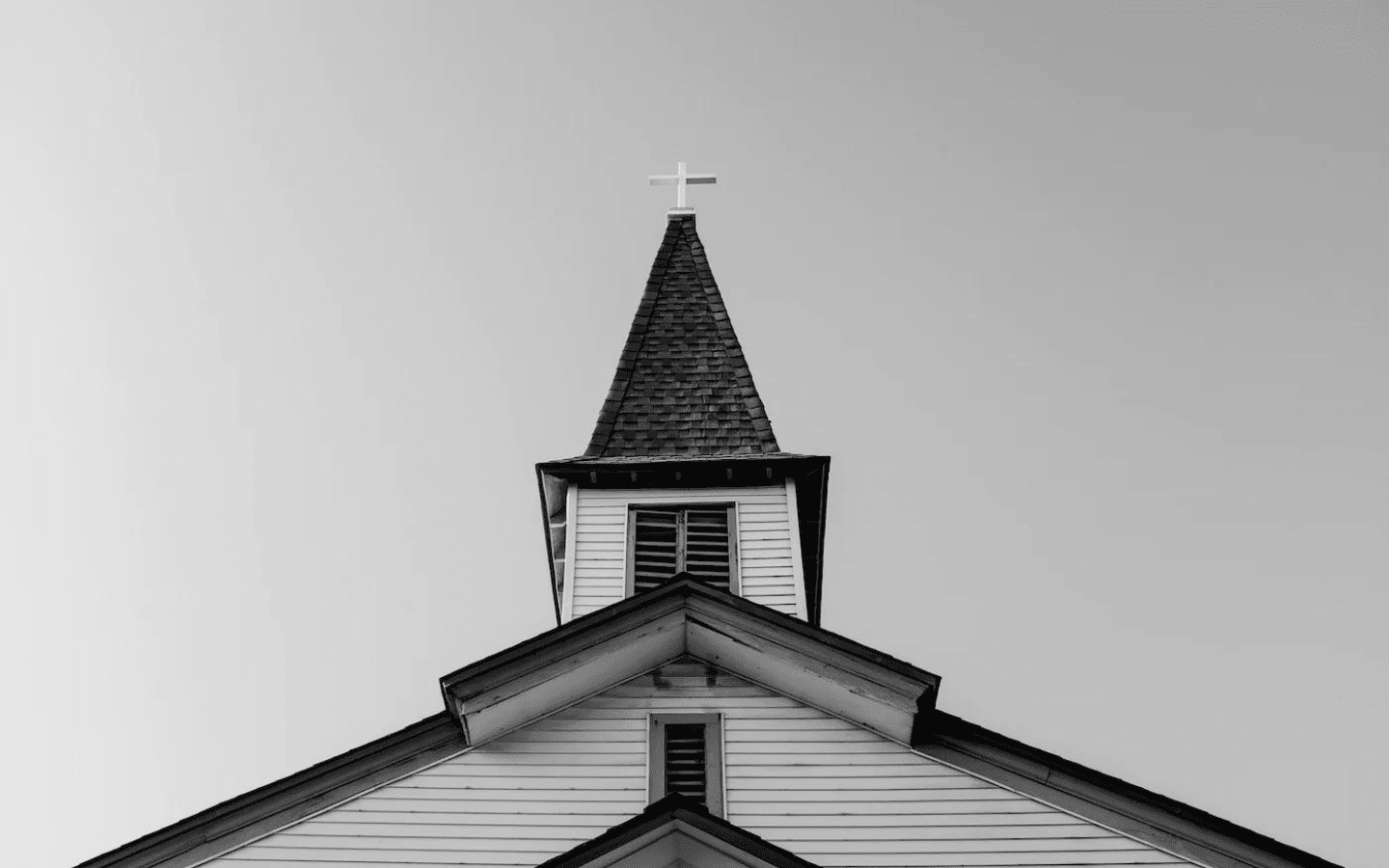 A church steeple in grayscale.