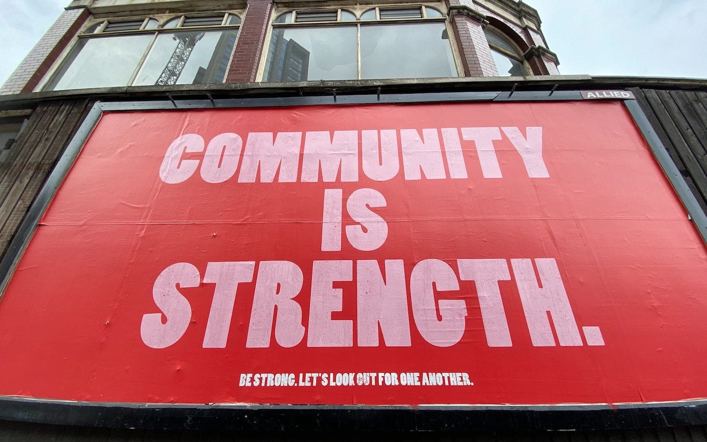 A red sign with white letters that says