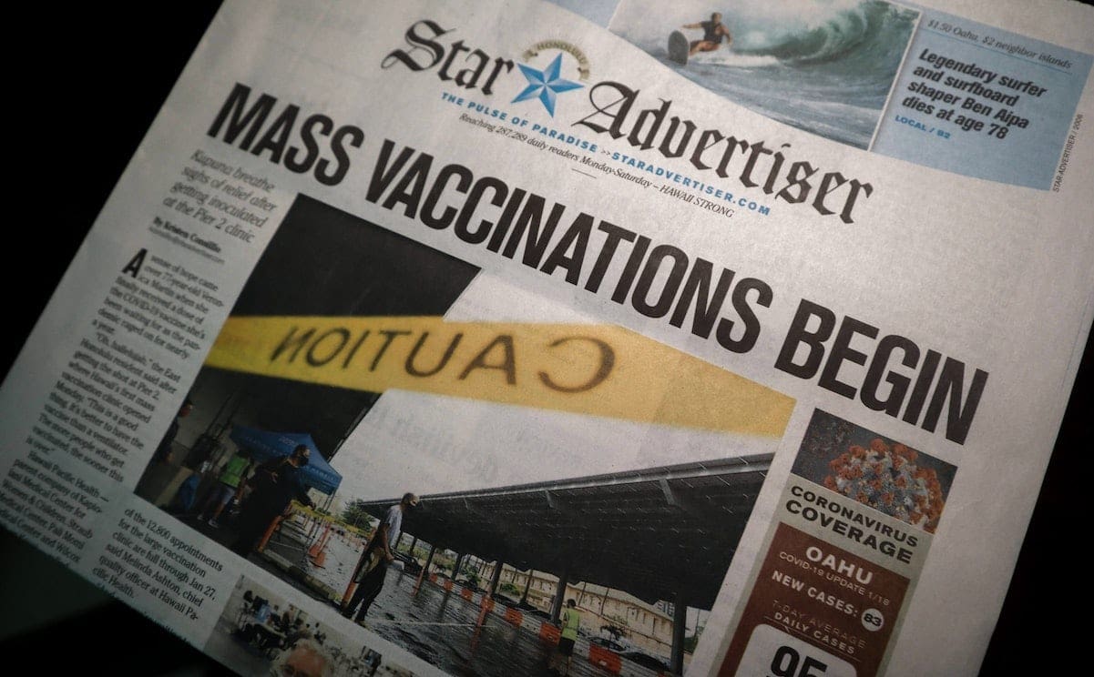 A newspaper with the featured headline reading
