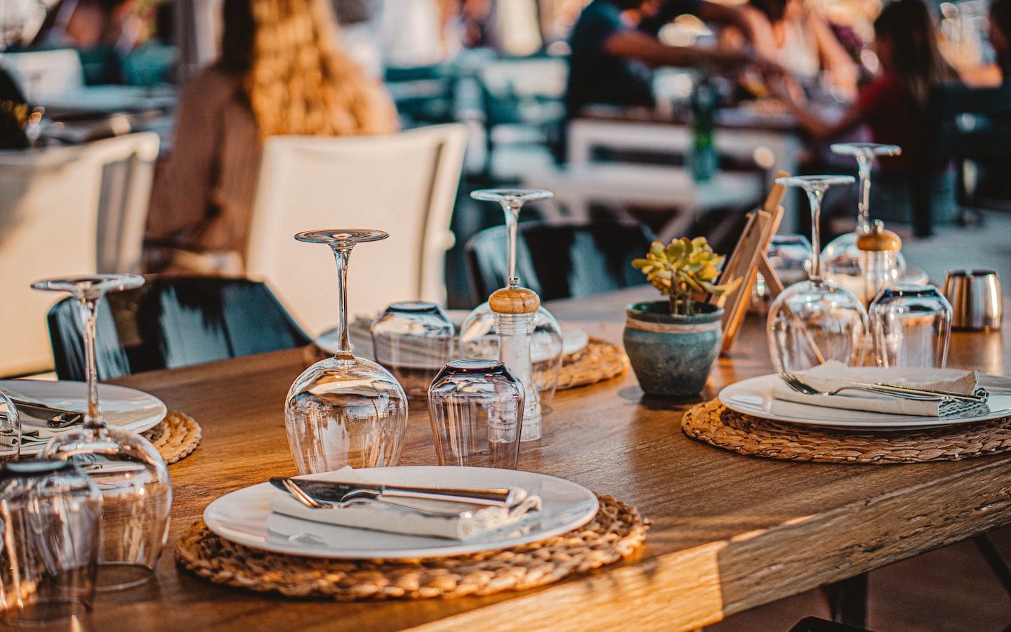 A table at a restaurant set with plates