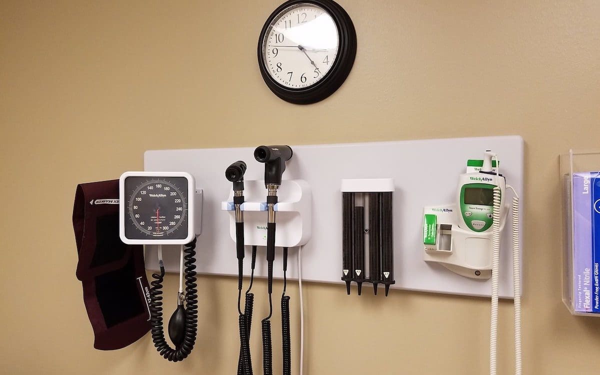 Medical equipment on the wall in a doctor’s office.