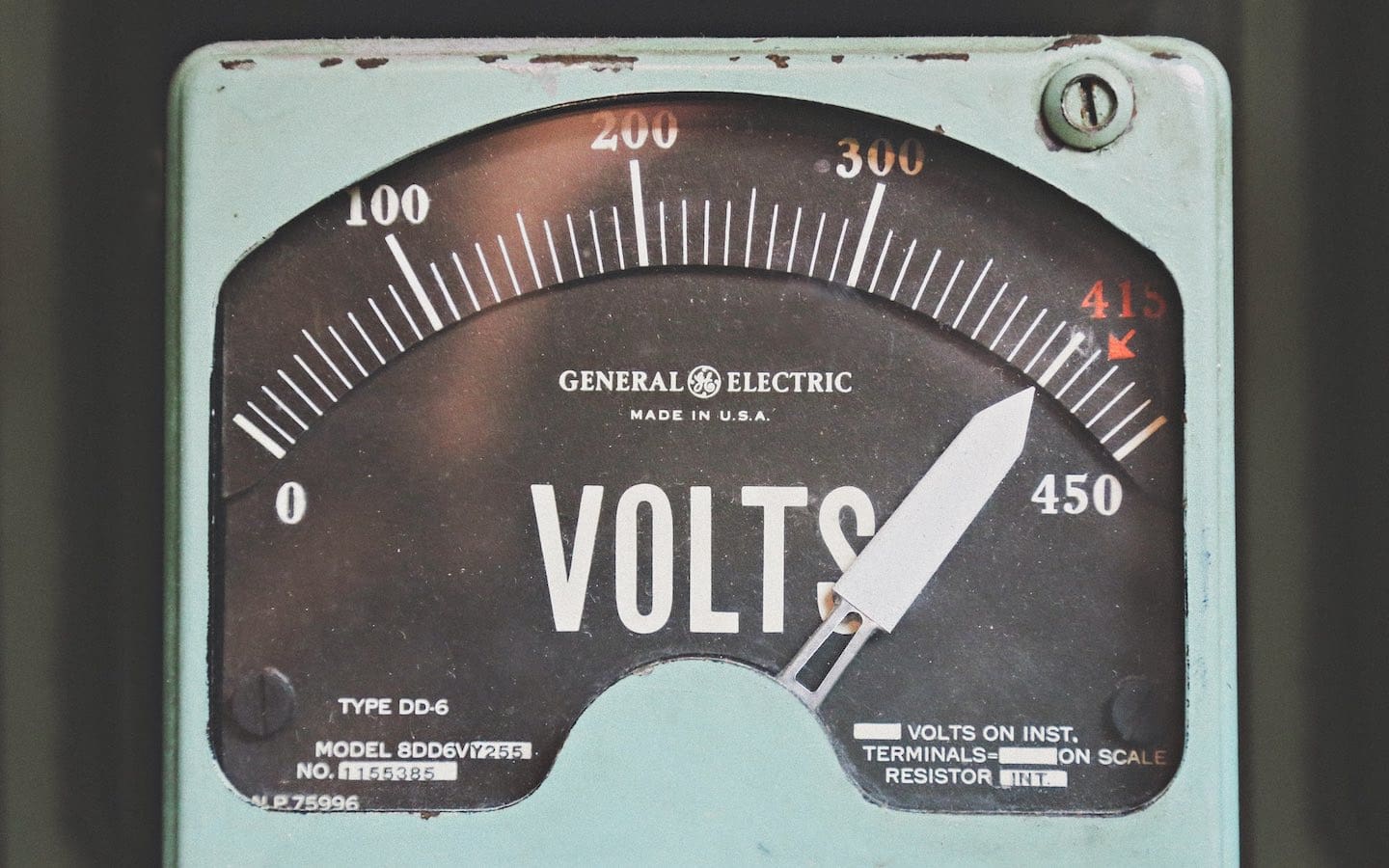 An older style General Electric brand volt meter.