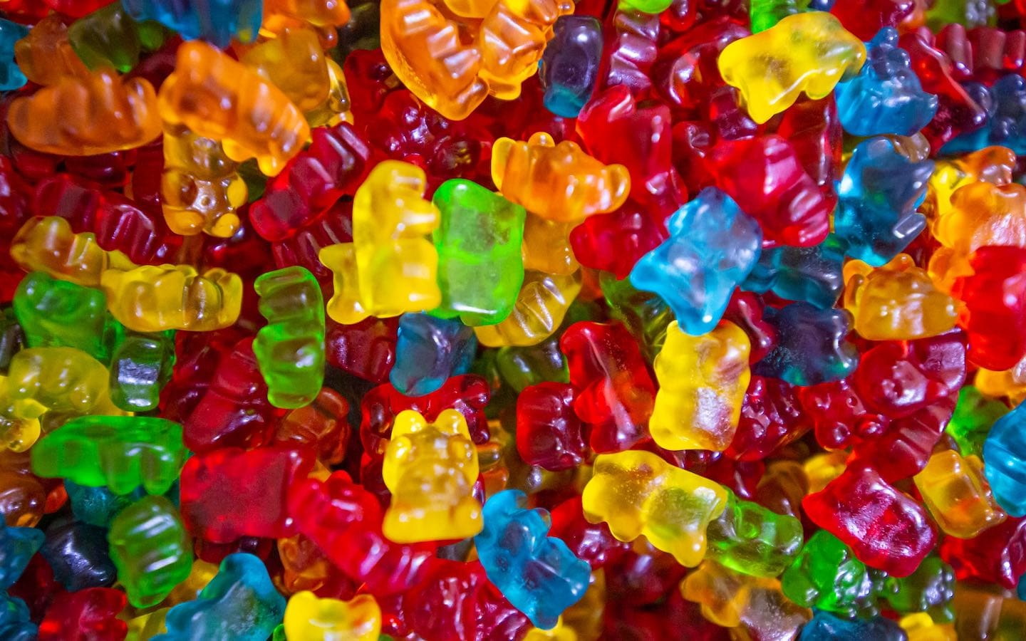 Gummy bears snacks in a pile seen up close.