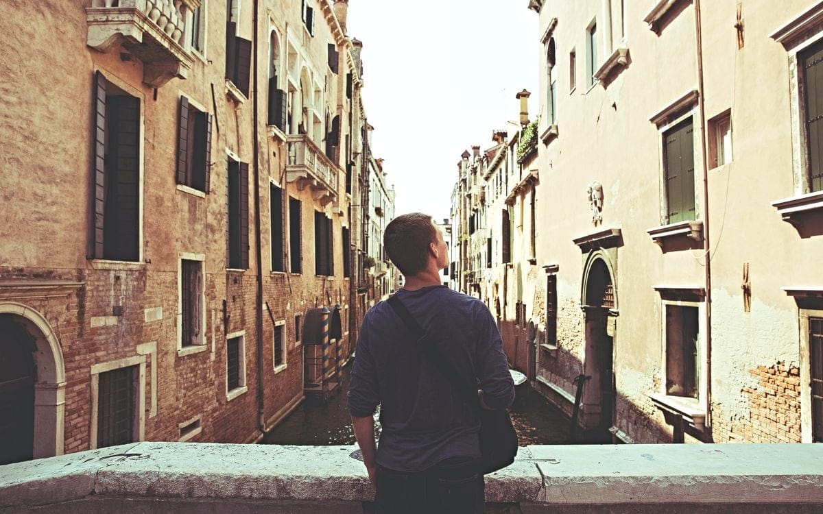 Latin American teenager looking down street