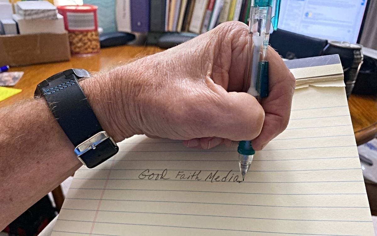 Left hand writing on table