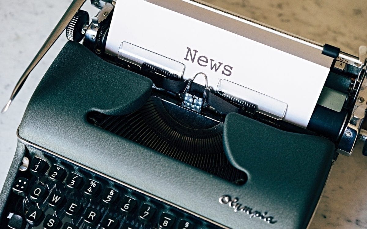 News typed on paper in typewriter