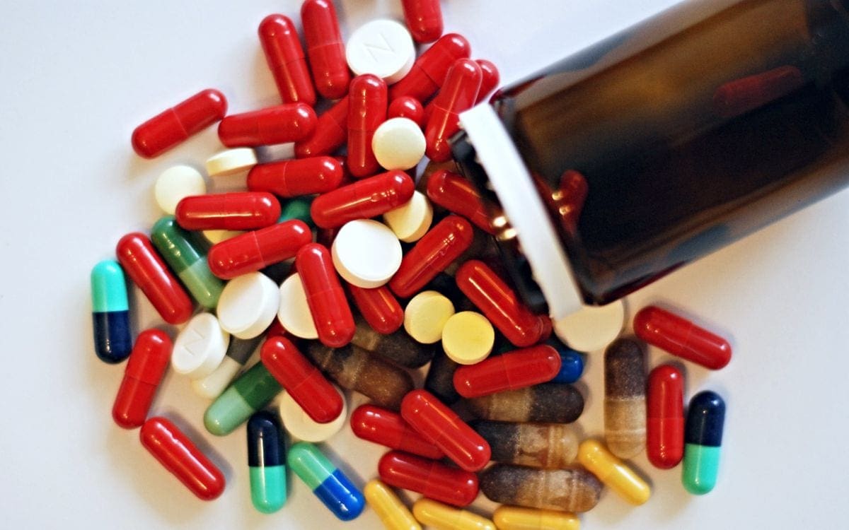 Prescription drugs spilling out of bottle