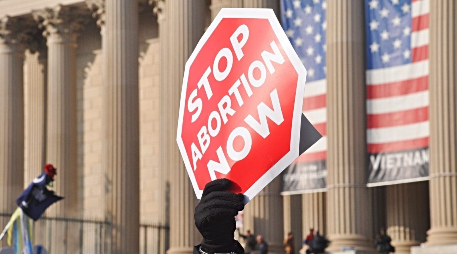 Protest sign shaped like stop sign and opposing abortion