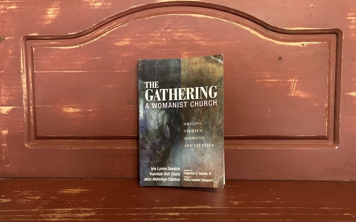 The cover of “The Gathering: A Womanist Church” book with a red background.