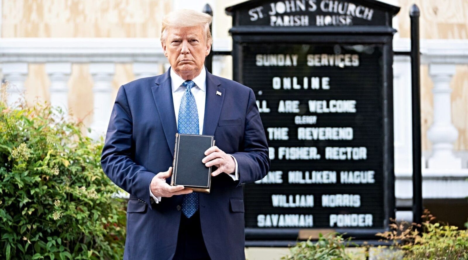 President Trump holding Bible in front of Episcopal church.