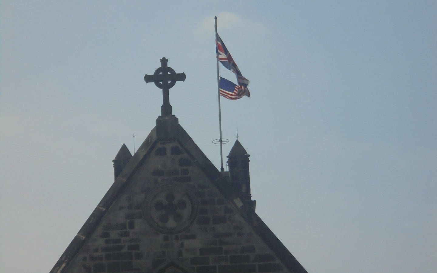 Flags of the United Kingdom and the United States flying on St. James' Church
