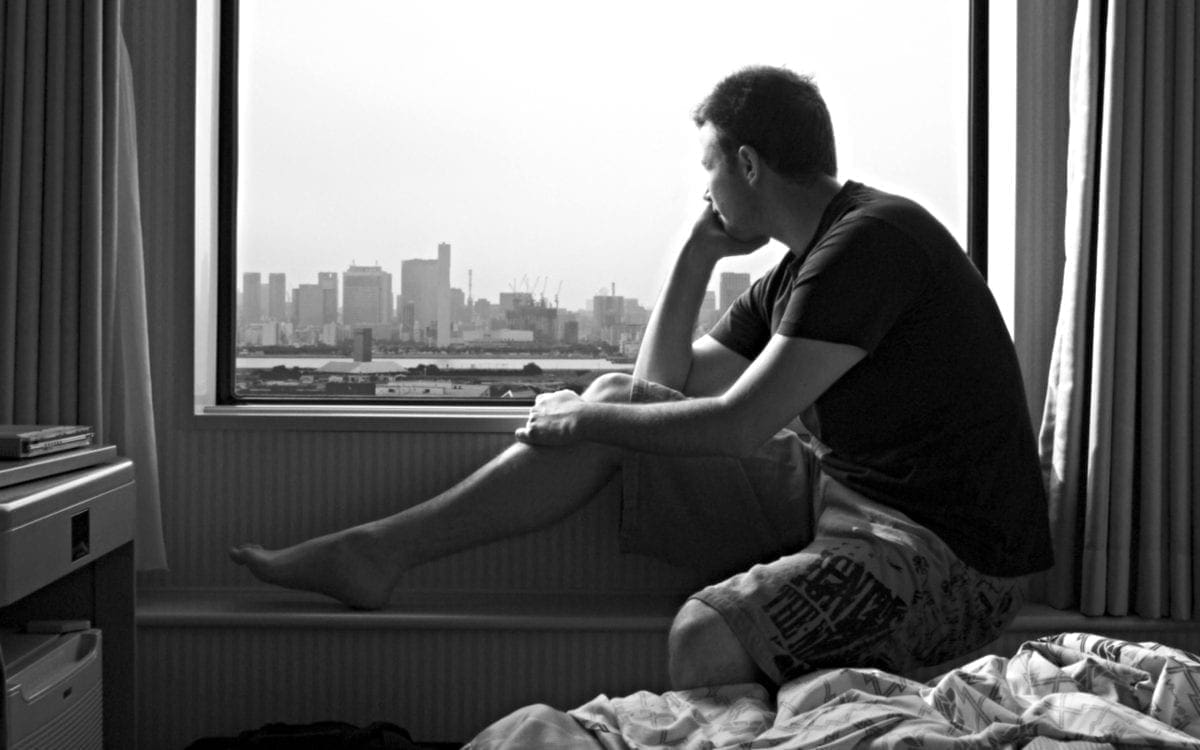 Man staring out window