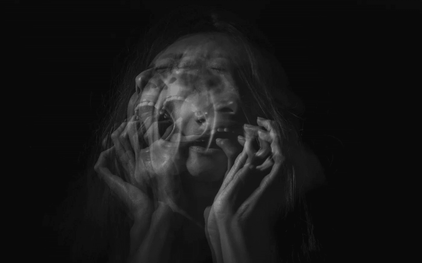 A photomontage of a woman screaming in agony or perhaps grief.