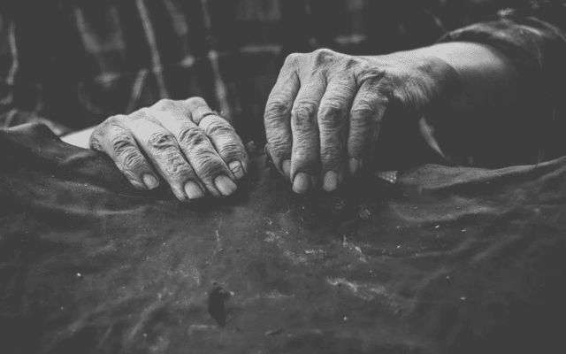 Man’s hands in grayscale.