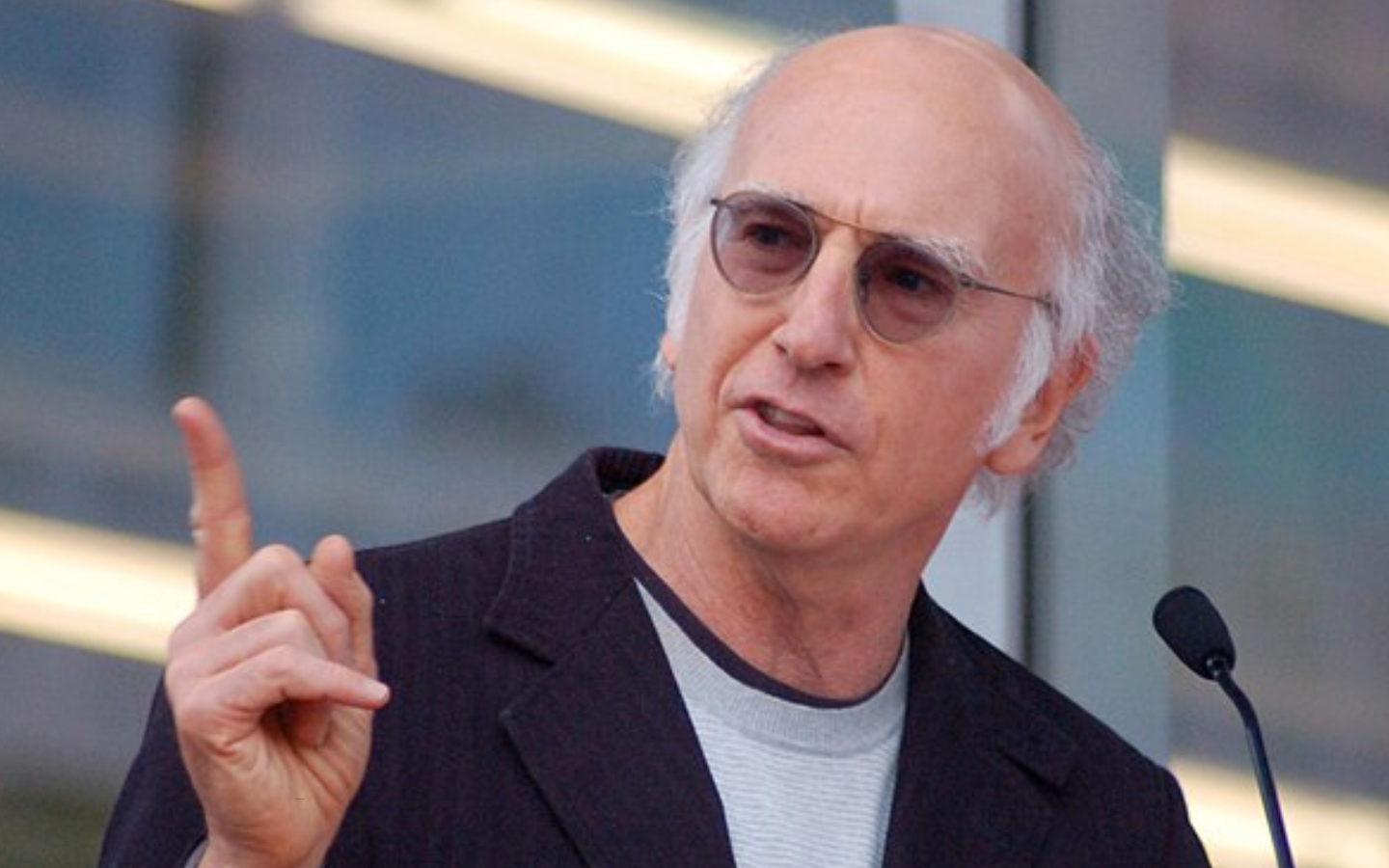 A photo of Larry David giving a speech.