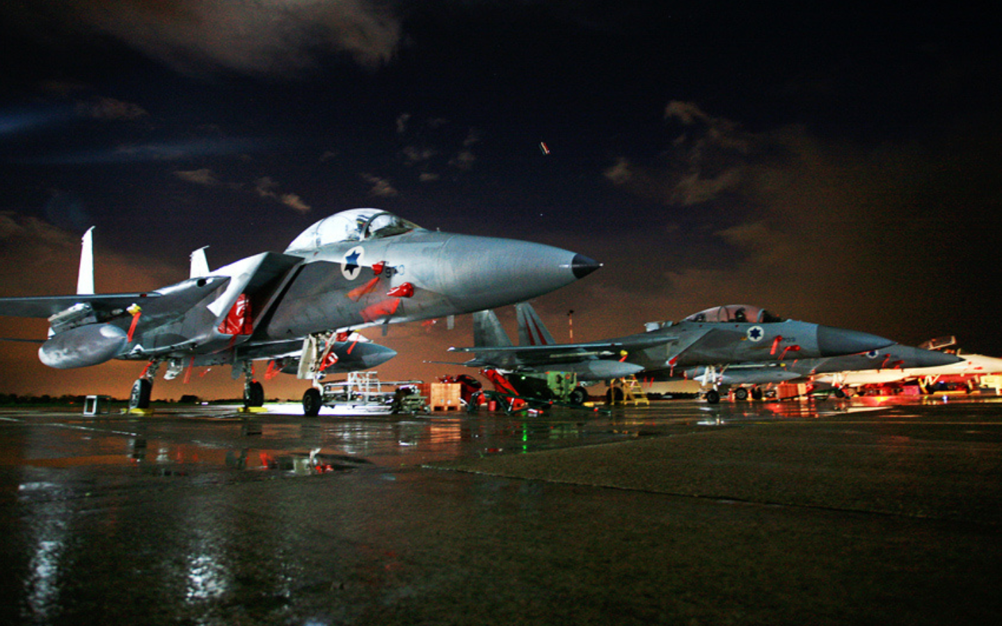 Israeli jets lined up at nighttime.