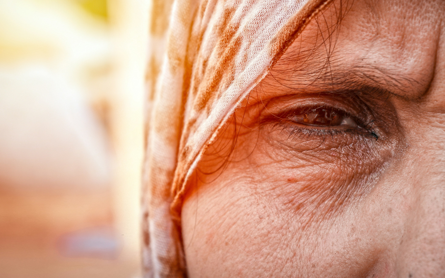A close-up of the face of a Palestinian woman.