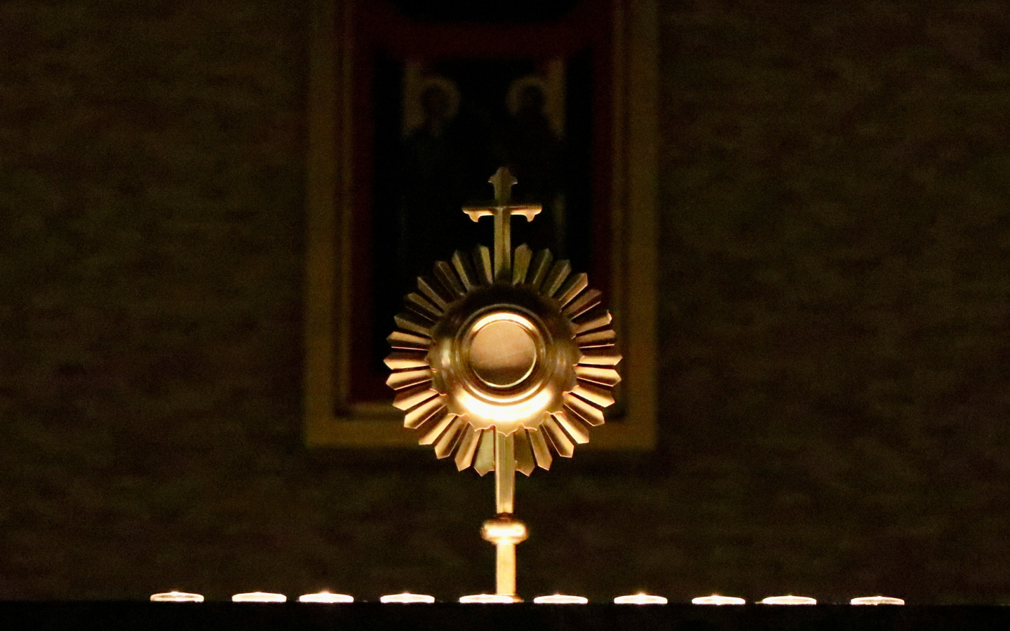 A cross in a dark sanctuary.