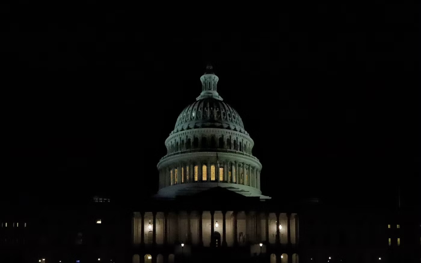 The U.S. Capitol lit up at night.
