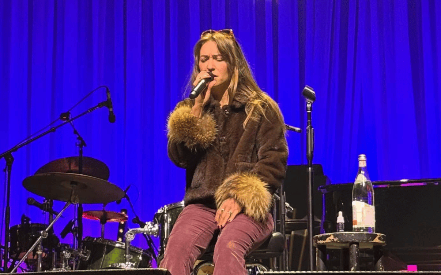 Lauren Daigle sits on stage in a pre-concert Q&A and song at the Midland Theatre in Kansas City.