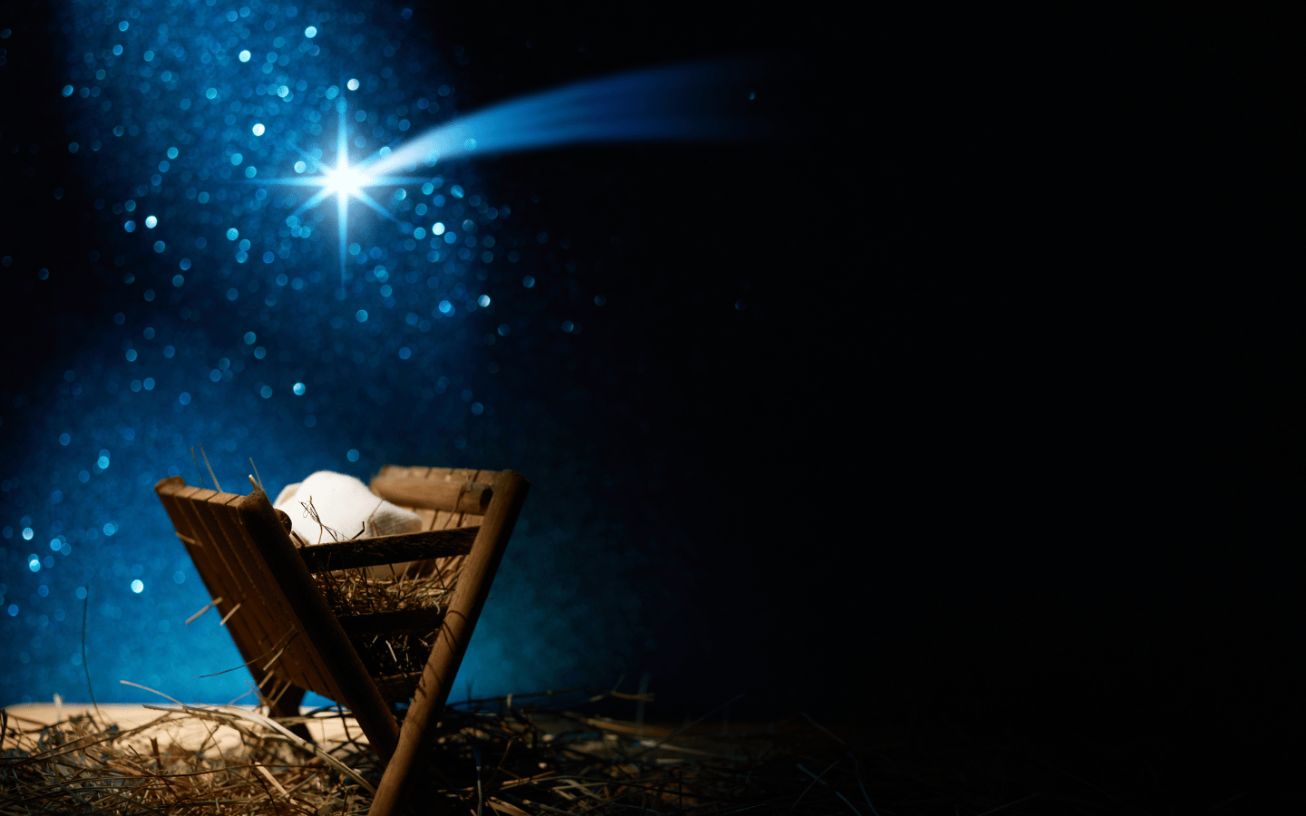 An artistic rendering of the Star of Bethlehem leading to the manger.