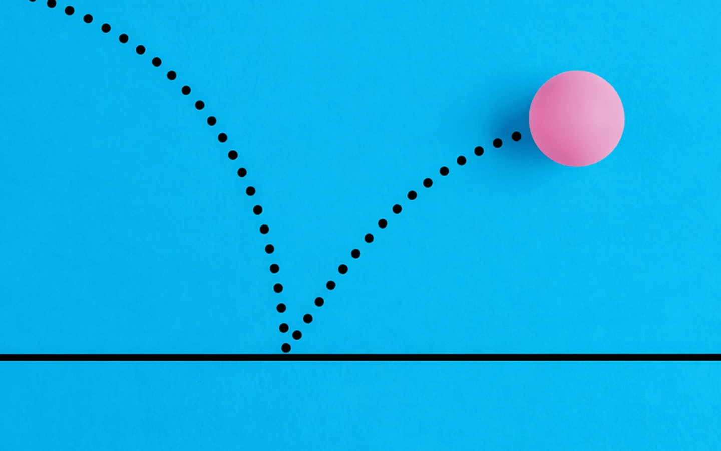 A dotted line following a pink ball.