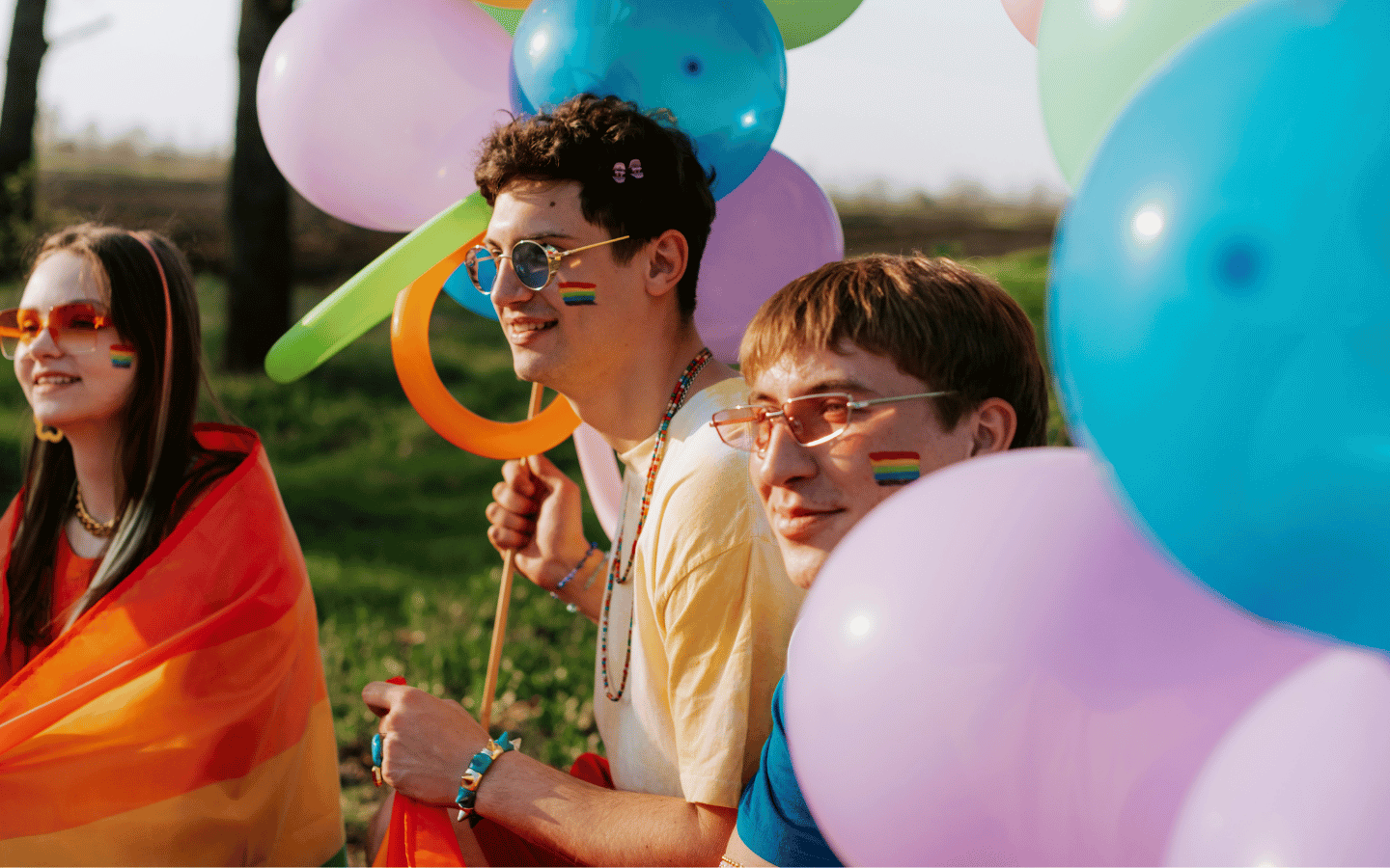 Young LGBTQ+ people attend a Pride event.