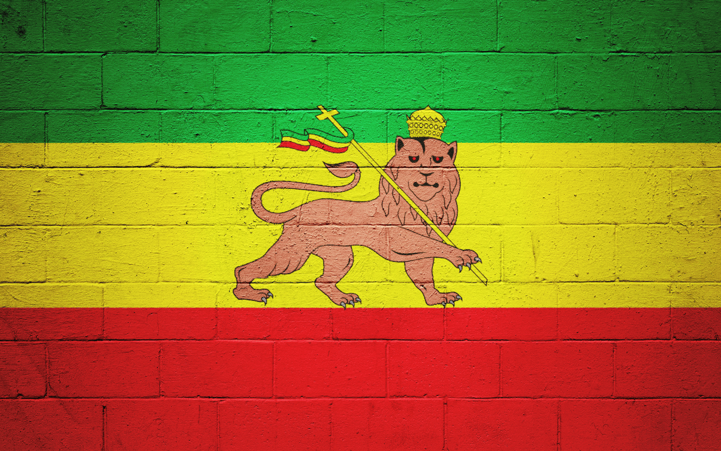 The Rastafarian flag painted on a wall.
