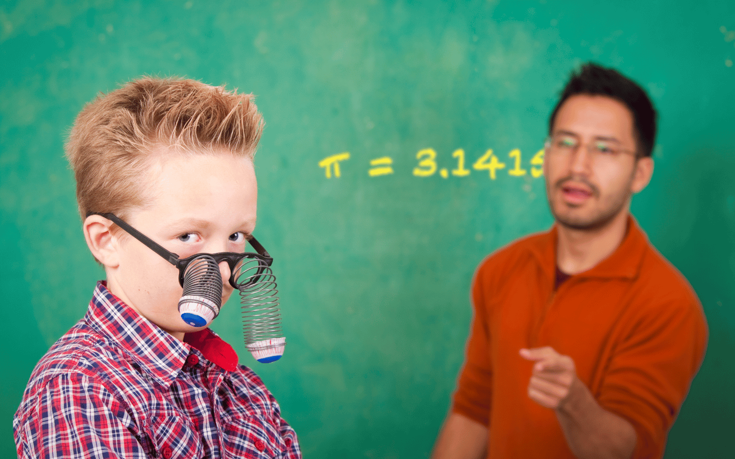 A kid wears a pair of clown glasses in class.