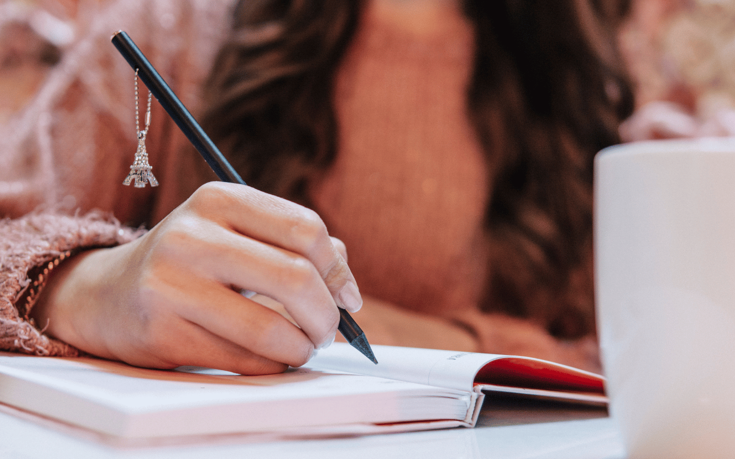 A girl writes in a journal.