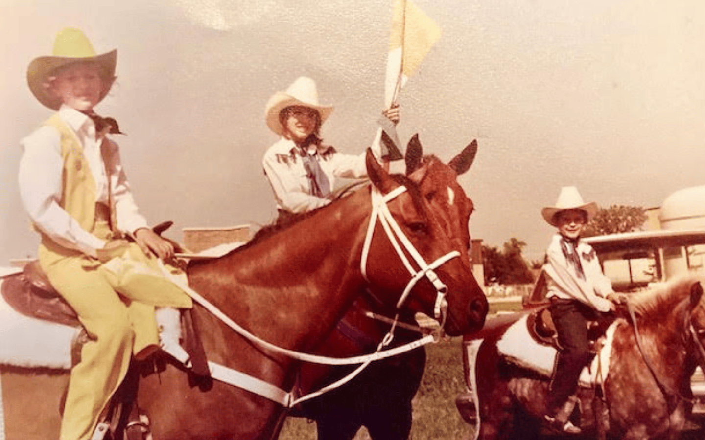 Rebecca Hensley riding a horse as a child.