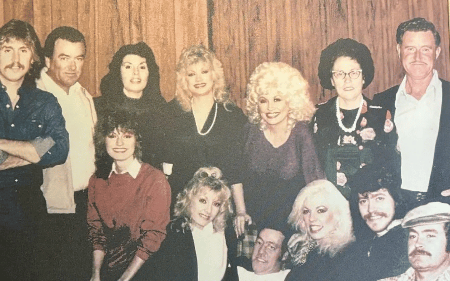 A photo of Dolly Parton with her siblings and parents.