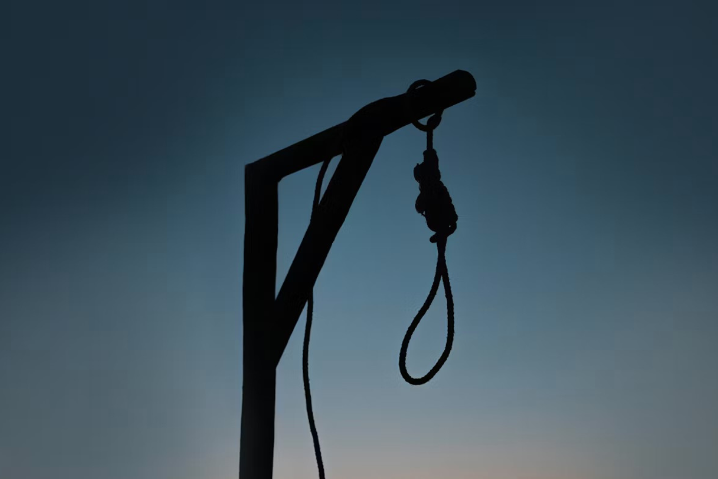 A noose attached to a wooden scaffold.