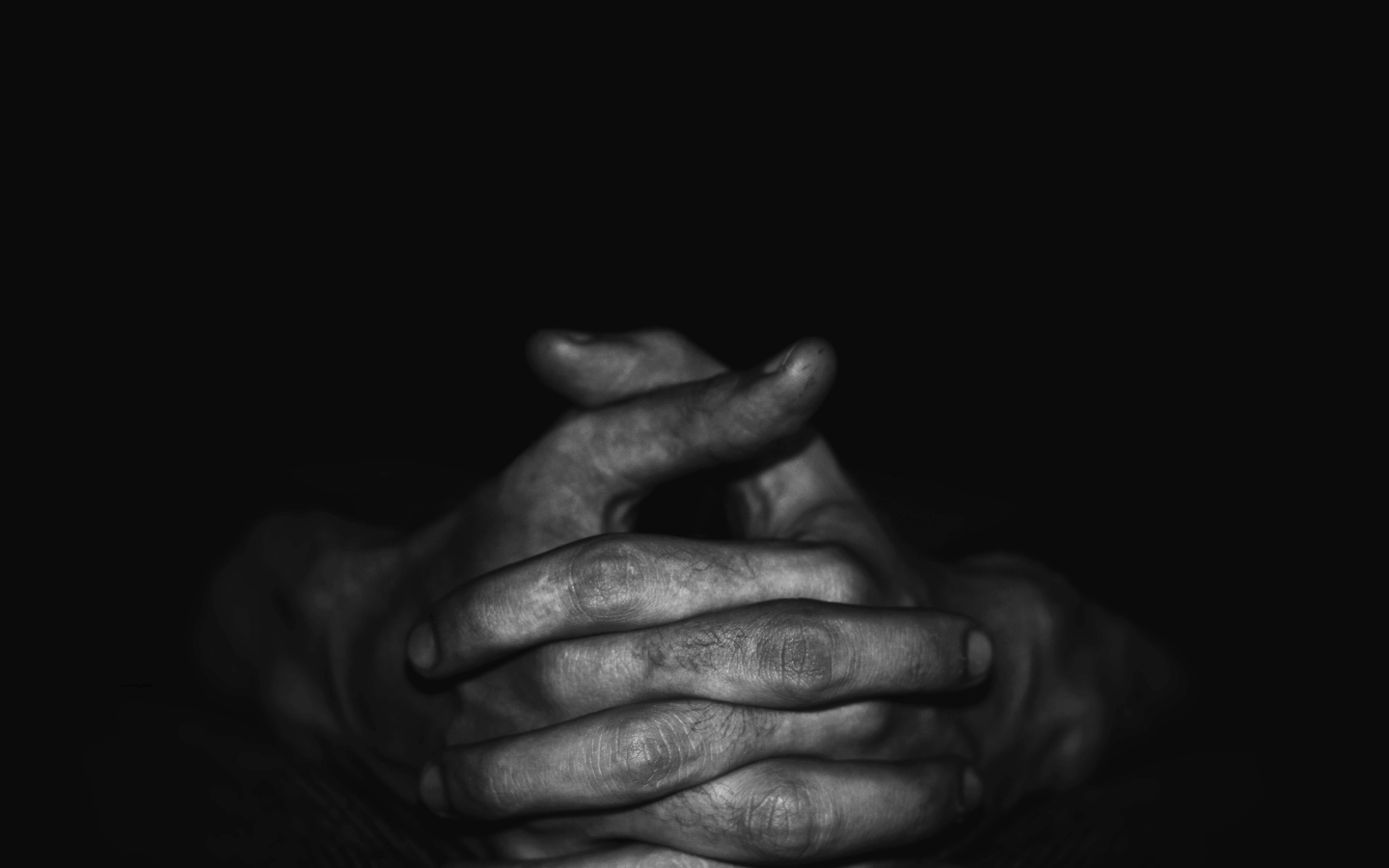 Hands folded in prayer.