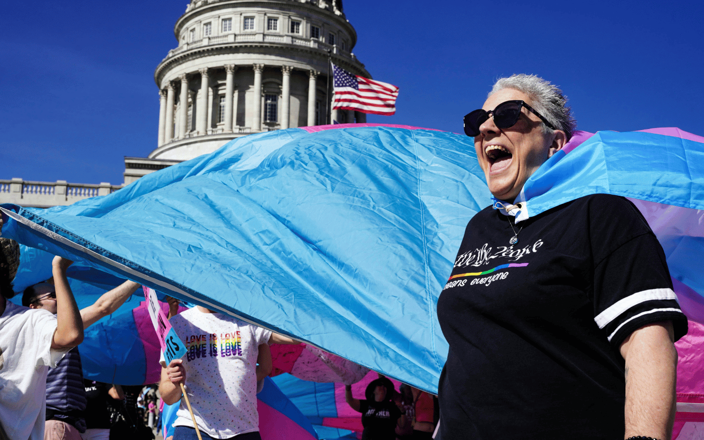 A trans-inclusive Pride demonstration in front of a state capitol building.