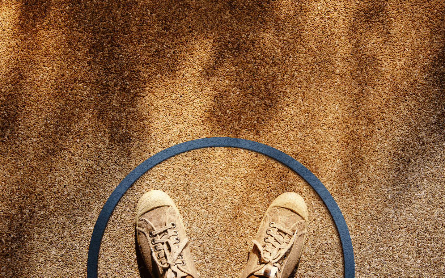 A person stands inside a bounded circle.