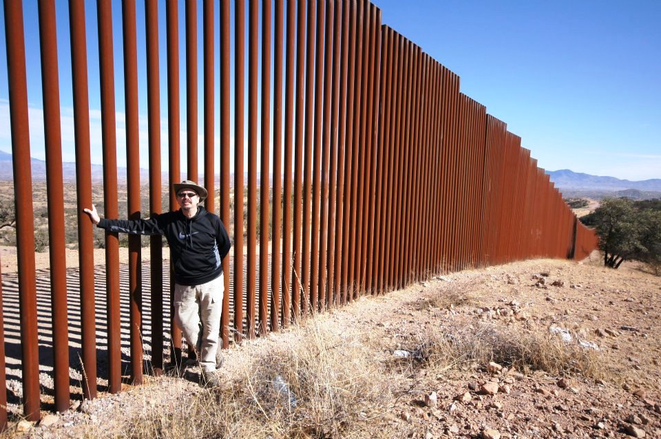 Miguel De La Torre at the U.S. Mexico border wall.